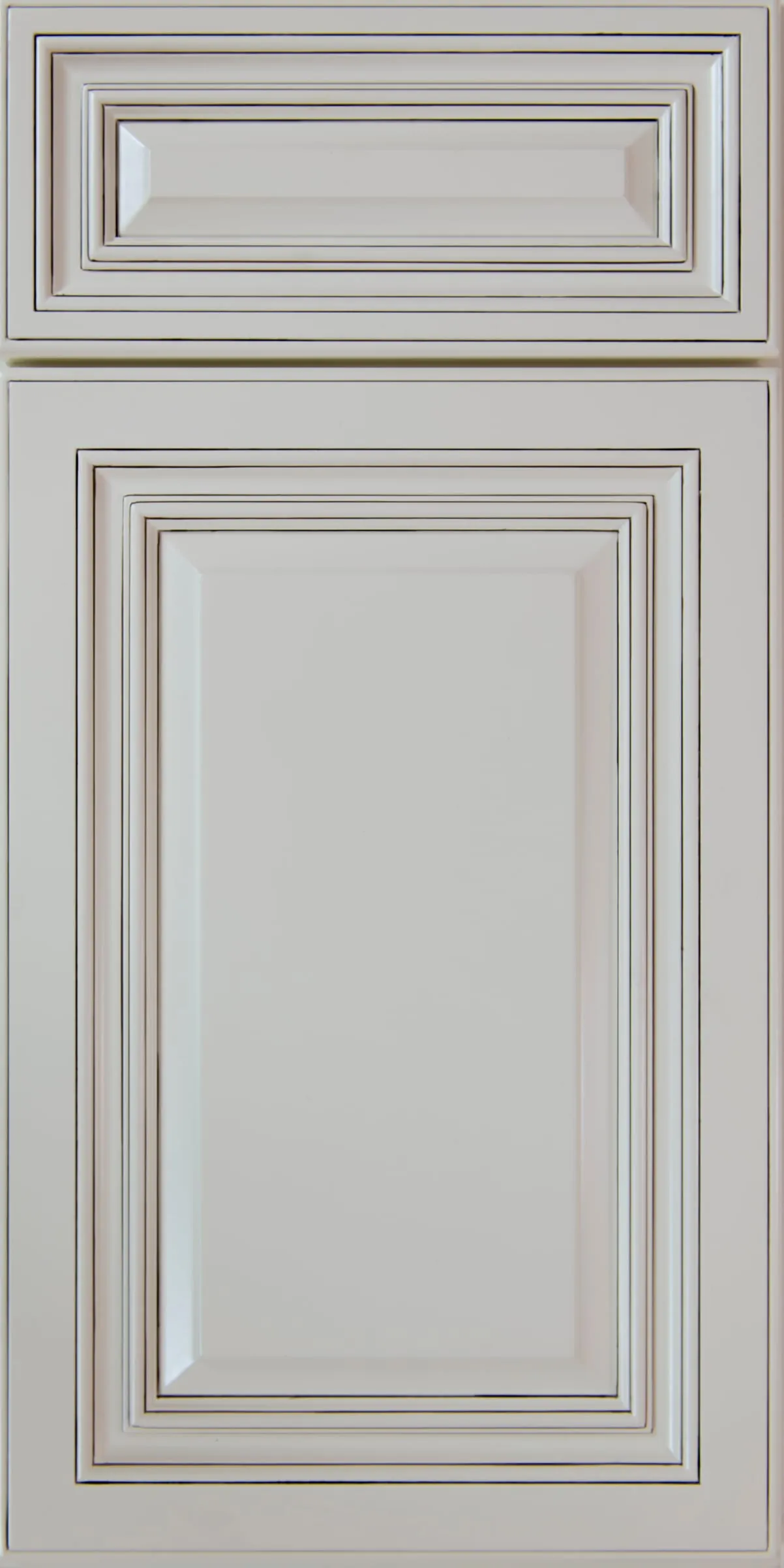 Antique-white raised-panel door and drawer with brown glaze in the profiles