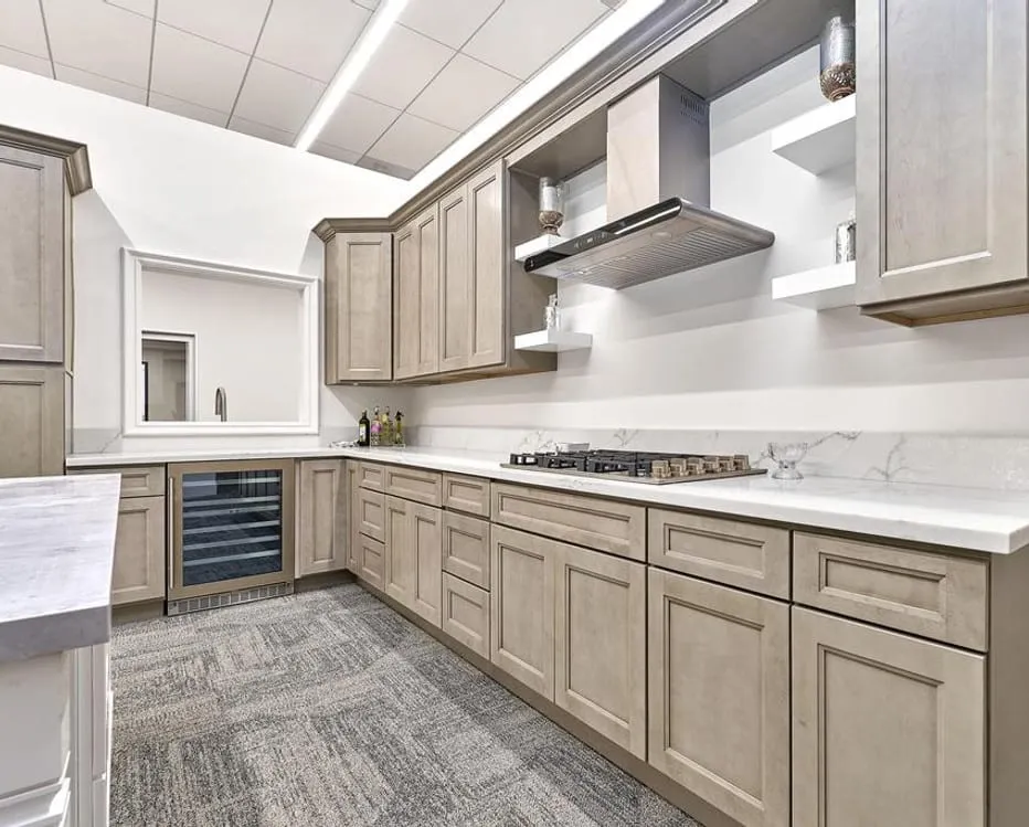 Ash / greige showroom kitchen run with white marble tops