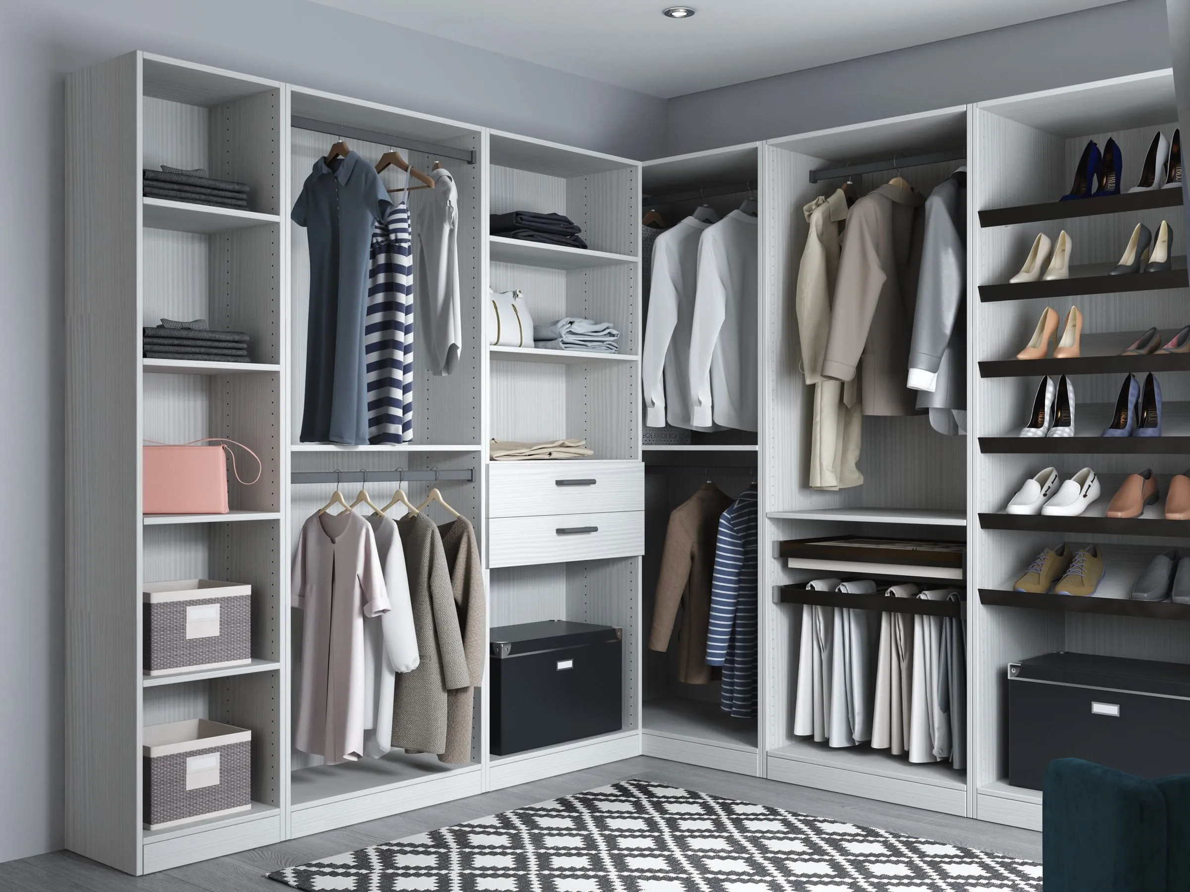 Corner walk-in closet in pale textured pine with tall open shelving, a pull-out valet rail, and a column of dark shoe shelves