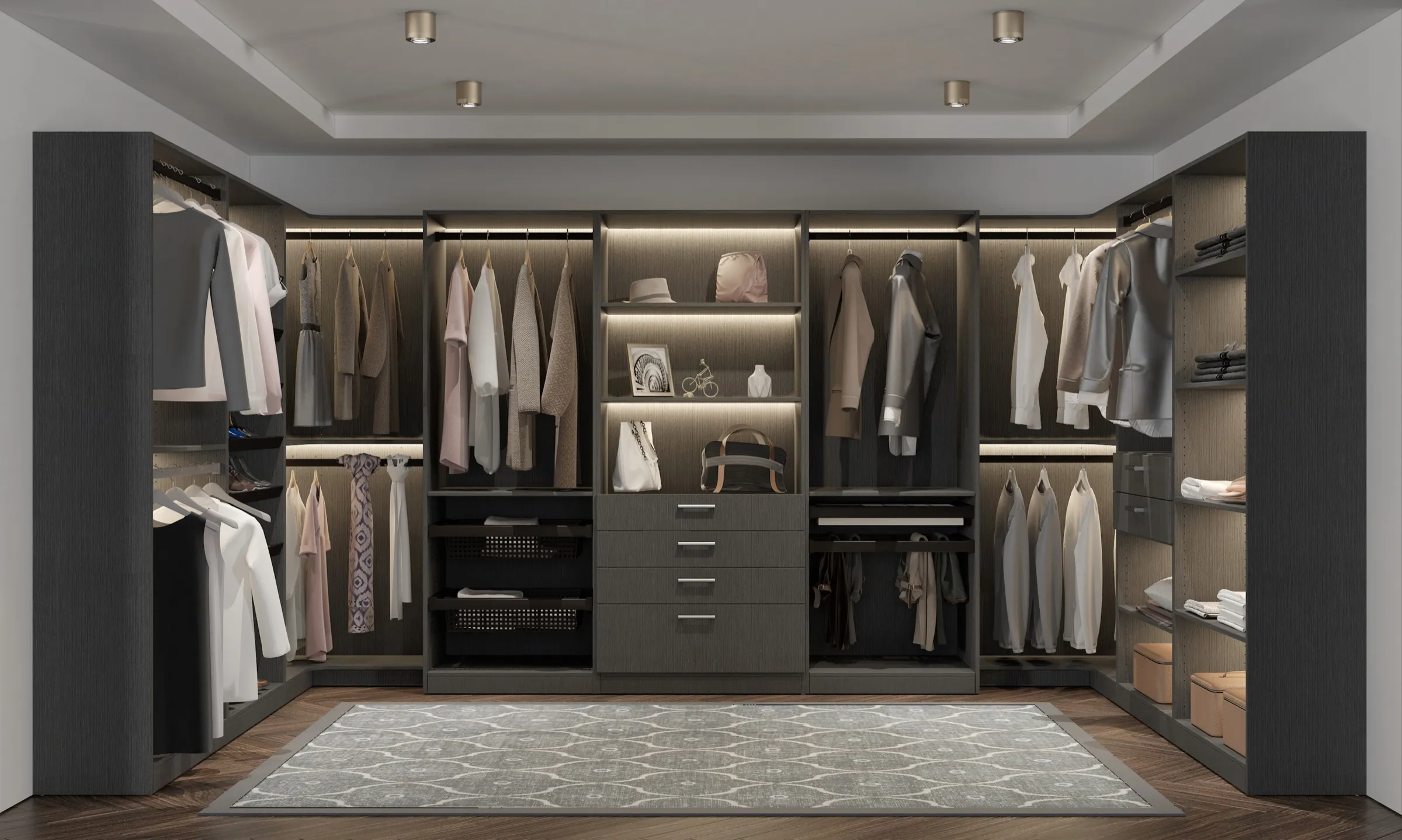 Dark charcoal walk-in closet with LED-lit shelving, pull-out wire baskets, and a central drawer tower