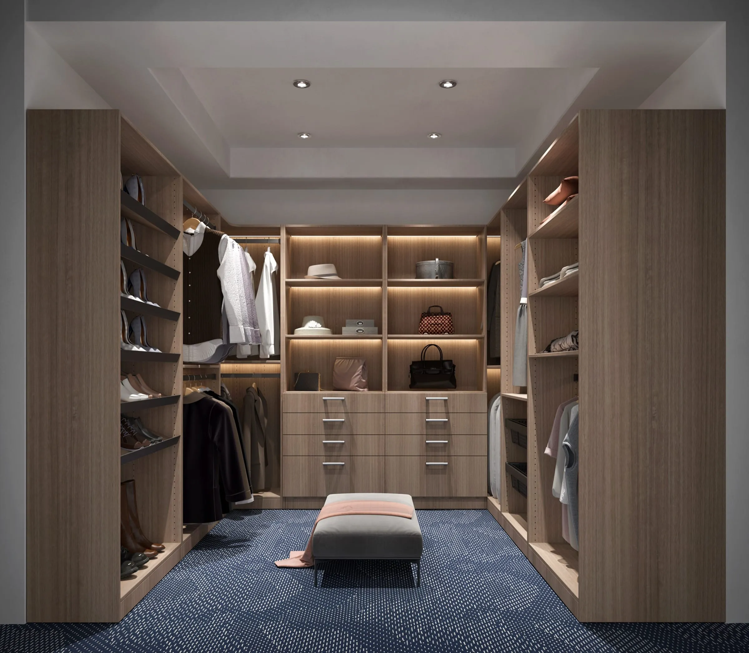 Light walnut walk-in closet with LED-lit center shelving, twin drawer banks, and angled shoe racks along one wall
