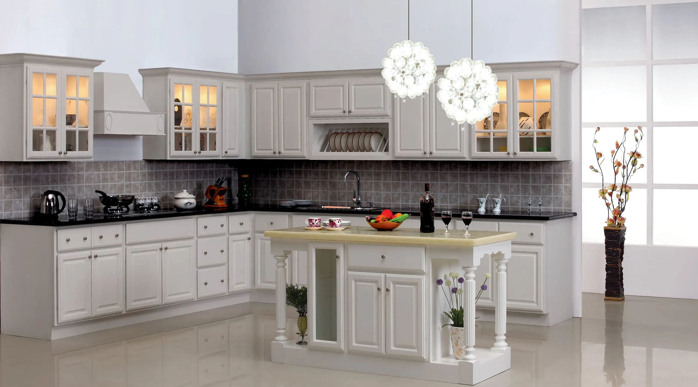 Classic White raised-panel showroom kitchen with black counters and a turned-post island