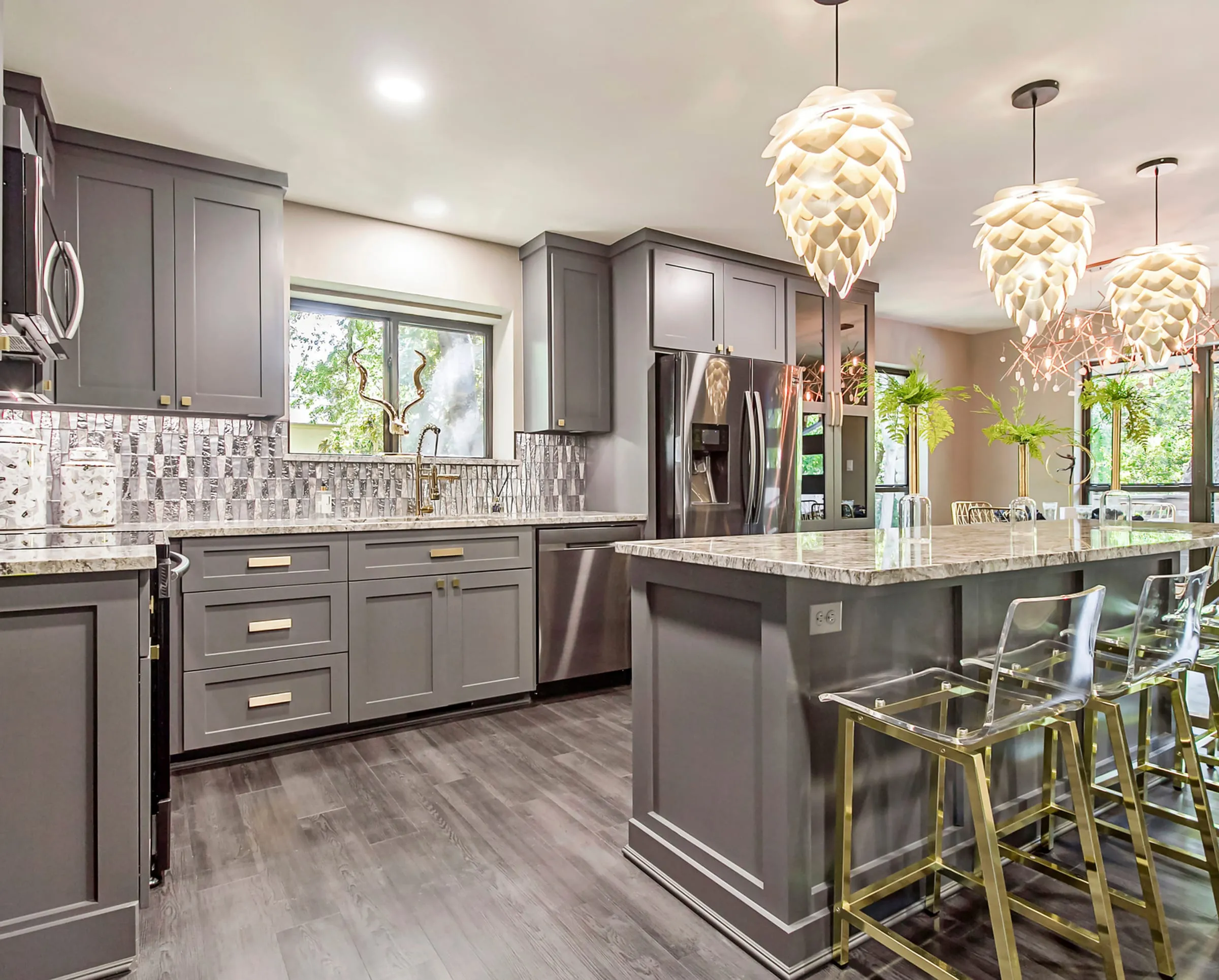 Grey shaker kitchen with pinecone pendants and a marble island