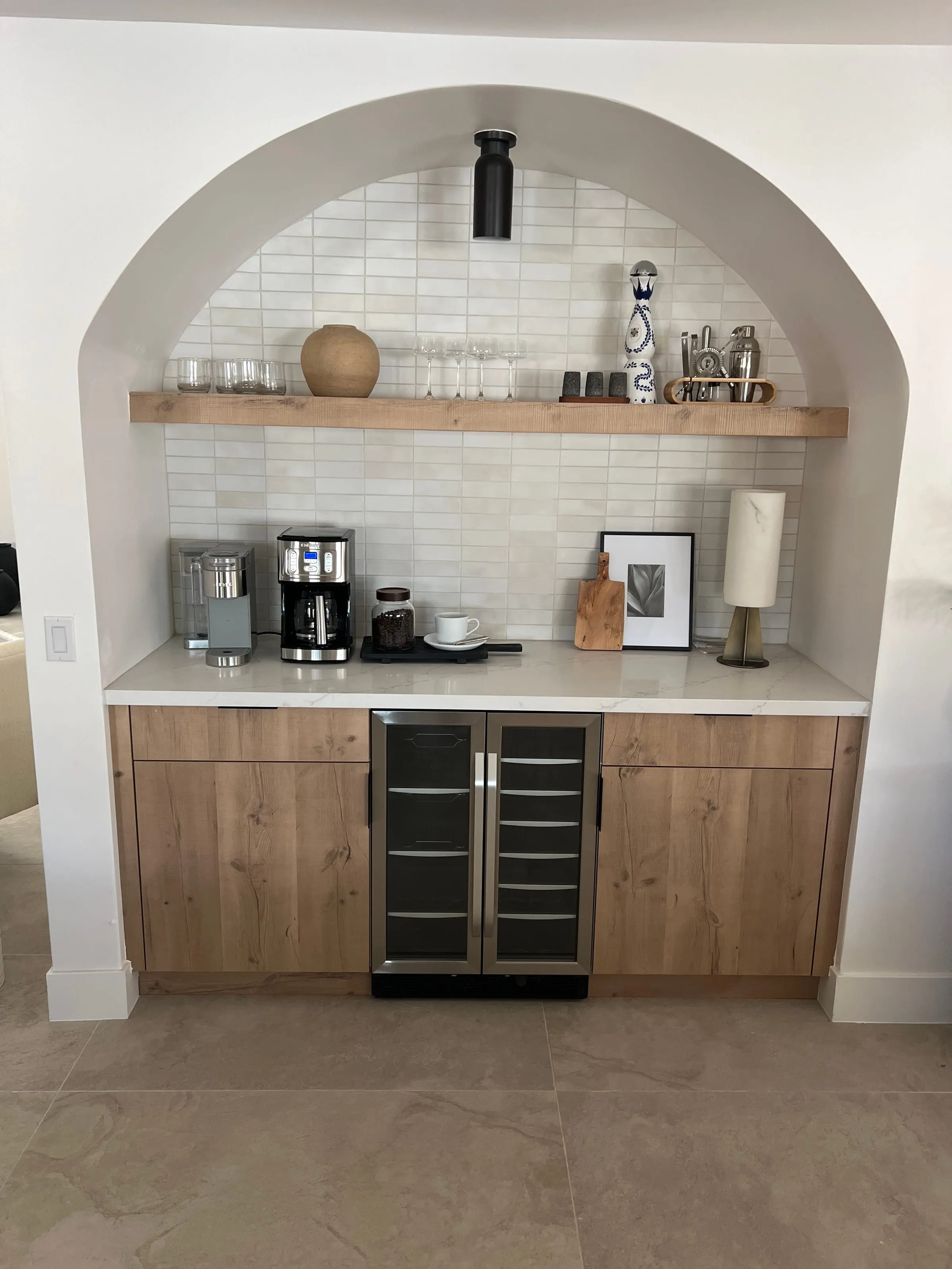 Arched coffee and beverage nook in Rustic Oak with a glass-front wine fridge