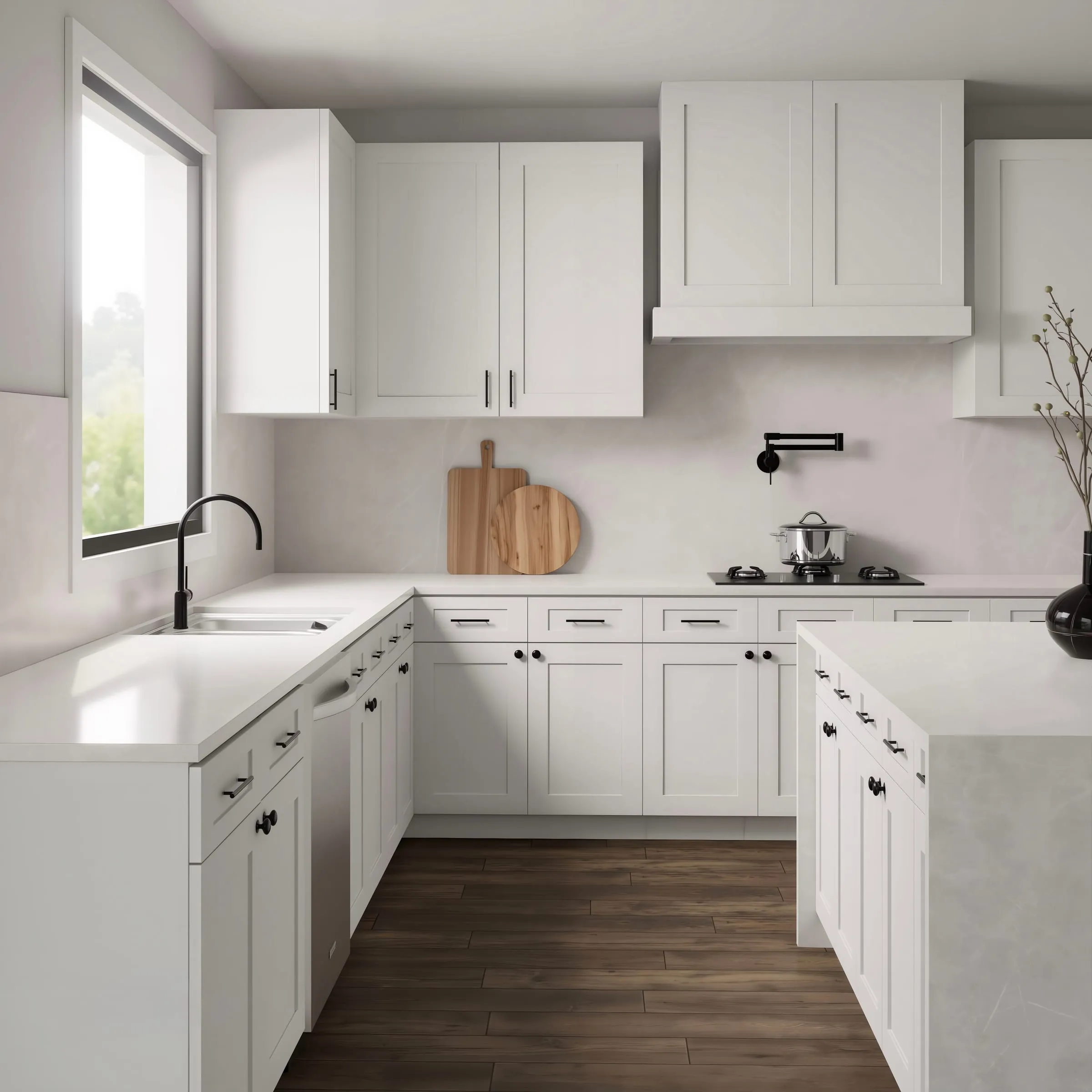 White shaker U-shaped kitchen with an island, black hardware, and marble counters