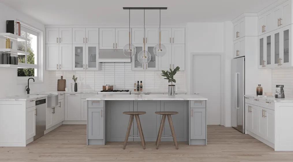 White shaker frameless kitchen with a gray island, gold pulls, and glass uppers